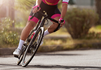 Fototapeta na wymiar Road bike cyclist man cycling, athlete on a race cycle. Leaning into a corner 
