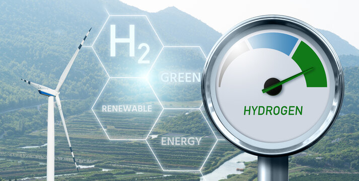 Hydrogen gauge with tree colors - gray, blue and green on a background of wind turbines. Green hydrogen production concept	