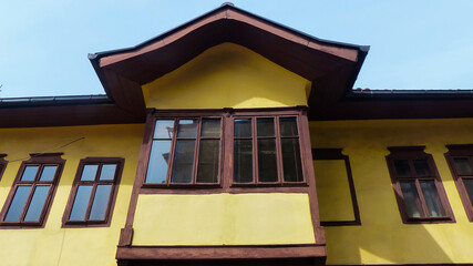 Side view and wooden windows of an old historical building from the Ottoman period in Serbia.
