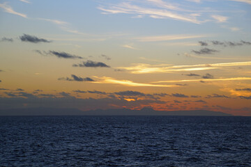 Magic of the Atlantic. Sunrise . Open ocean waves horizon and clouds. Bright colors.	