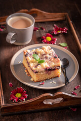 Homemade yeast cake with icing and fruits..