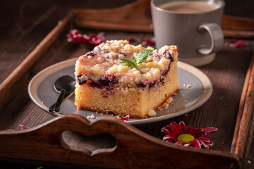 Homemade yeast cake made of fruits and icing..