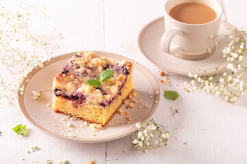 Homemade yeast cake as summer dessert with coffee..