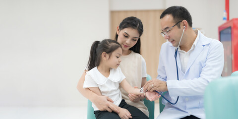The pediatrician examined the health of the girl