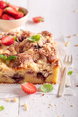 Sweet and homemade strawberry cake with fresh fruits and sugar.