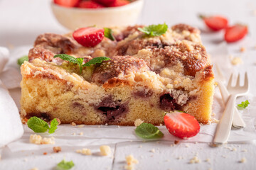 Sweet and homemade strawberry cake made of yeast dough.