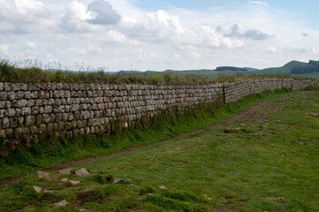 Fototapeta na wymiar A section of Hadrian's Wall, nearby to the remains of Roman military base Milecastle 39, as well as Sycamore Gap. Northumberland National Park, UK
