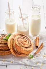 Tasty and sweet cinnamon rolls served with milk.