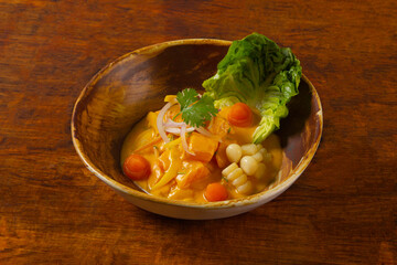 Ceviche on bowl and wooden table