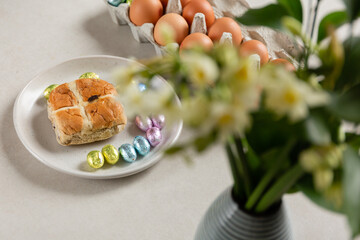 spring easter holiday. beautiful background with eggs and flower on a white plate.