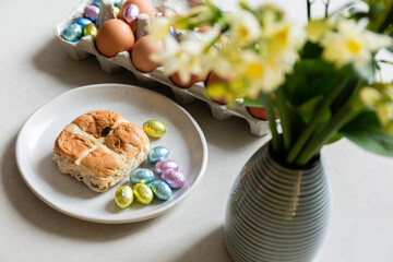 spring easter holiday. beautiful background with eggs and flower on a white plate.