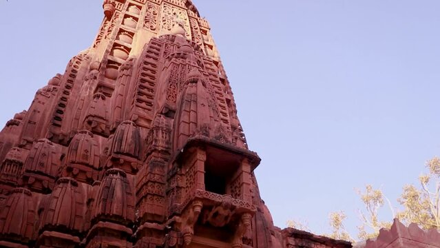 red stone ancient hindu temple architecture from unique angle at day