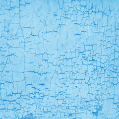 Obraz premium Close-up of the texture of blue peeling plaster. An old plastered wall