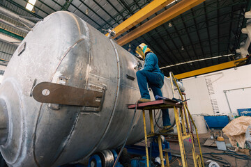 Welding arc argon worker tank stainless male repaired metal is welding sparks industrial...