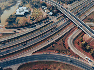 Fototapeta na wymiar Top view of the road runway through the green Aerial view car truck drivers