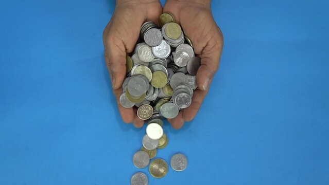A handful of coins falling, Indian Rupee coins, in debt, Indian Finance Concept