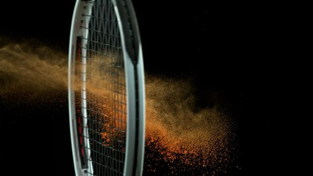 Super slow motion of hiting tenis ball, black background, filmed on high speed cinematic camera at 1000 fps