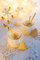 Christmas eggnog with the addition of powdered nutmeg in a festive decoration. Delicious drink and dessert