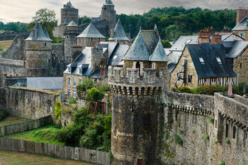 View of the medieval wall and castle of the French town of Fougeres.