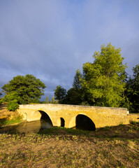 Romanesque bridge of Artigue and river Osse near Larressingle on route to Santiago de Compostela, UNESCO World Heritage Site, departement Gers, France