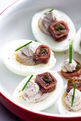 eggs filled with anchoa spread with anchoa on the top