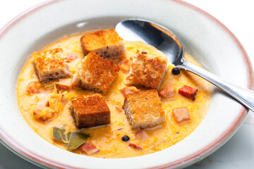 cabbage soup with smoked meat and toasted bread