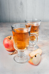 two glasses of apple juice on the table, lifestyle