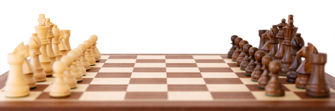 Banner size photo of wooden chess set, isolated white background