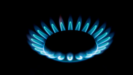 blue gas stove flame in the dark