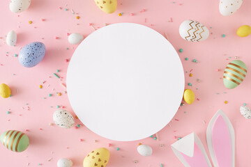 Easter decor concept. Flat lay photo of white circle easter bunny ears yellow blue white and green eggs sprinkles on pastel pink background with blank space - obrazy, fototapety, plakaty