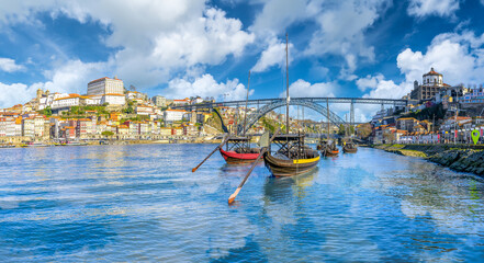 Fototapeta na wymiar Landscape with boats on the Douro River in Porto, Portugal