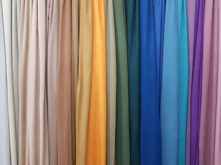 Clothes stack. Bright colourful rainbow fabric