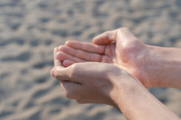 Man empty hands open up on desert background. No water, hot summer