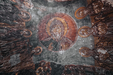 A cave church in Cappadocia with inscriptions on the walls, frescoes from the beginning of Christianity.