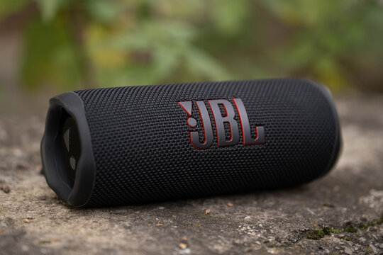 LVIV, UKRAINE - OCTOBER 12, 2022: JBL Flip 6 Black, Portable Bluetooth Speaker Outdoors.