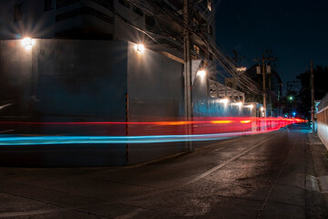 multicolored blurred colors of car in the city at night