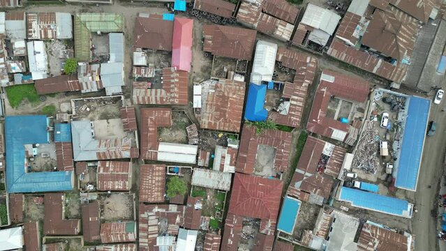 Aerial view of Mbeya city in Tanzania, Africa. Town is located in south west of Tanzania. Narrow highland valley surrounded by a bowl of high mountains.
