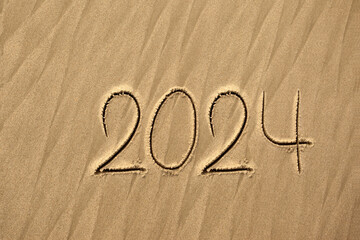 2024 inscription on the sand