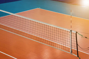 Sports image backdrop: volleyball net in an old empty sports gym. Top view, background for team...