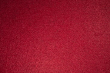 Red felt surface close up. Abstract texture and background.for christmas and new year design