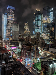Modern skyscrapers of the Midtown Manhattan skyline in New York City with colorful night lights
