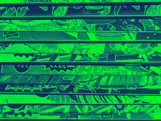 Vintage comic book collection stacked in a pile creates background pattern with green and blue colors