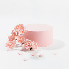 Fashion spring cylinder podium mockup with twig of gentle pink sakura flowers, petals in sunlight...