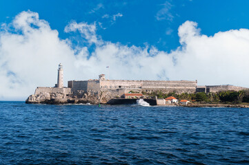 Architecture of Old Havana in Cuba. Everyday life with cars, houses and people.