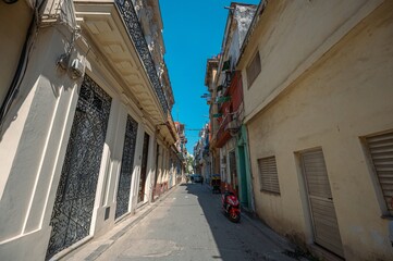 Architecture of Old Havana in Cuba. Everyday life with cars, houses and people.