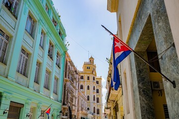 Architecture of Old Havana in Cuba. Everyday life with cars, houses and people.