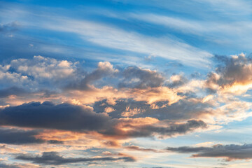 Naklejka na ściany i meble Beautiful evening sky with clouds at sunset.