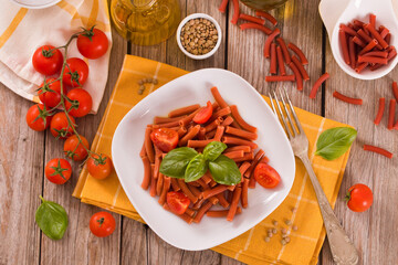 Lentil pasta with cherry tomatoes and basil.