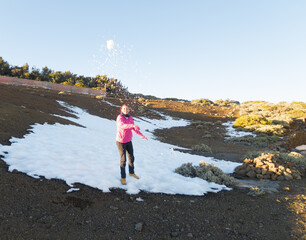 Winter Fun: A Smiling Girl Throws a Snowball