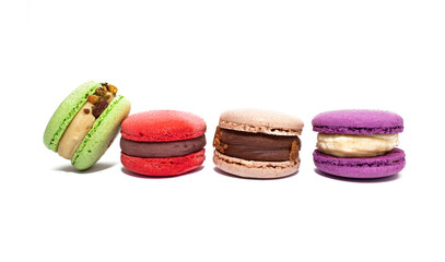 Sweet colorful macarons isolated on white background. Tasty red, green, brown, violet macaroons.